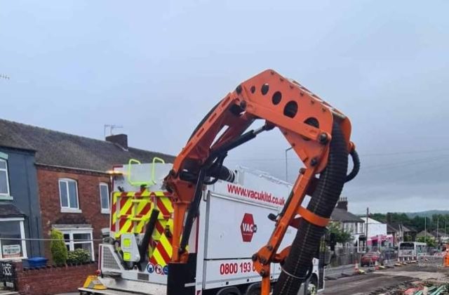 Vacuum excavation used to negotiate dense utilities.